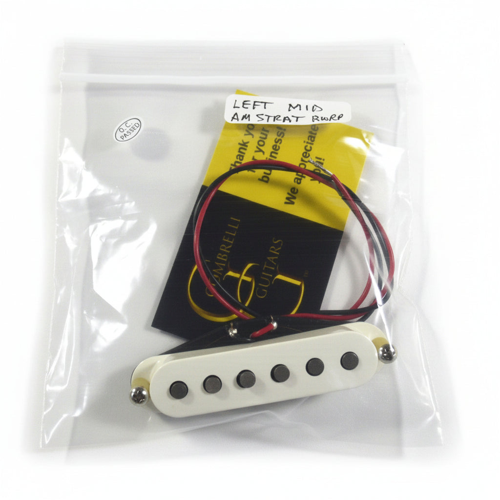 A guitar pickup in a clear plastic bag with its original yellow and black Guitars Direct card and handwritten note on a white fabric background.